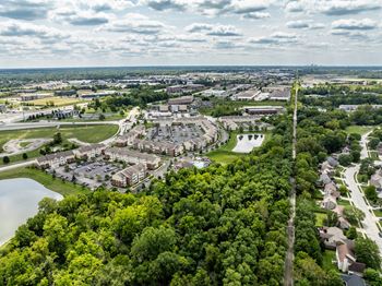 An aerial view of a city with houses and trees
